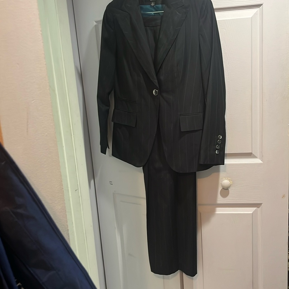 Signature (Larry Levine) size 8 blue suit with pinstripes of aqua and burgundy.
